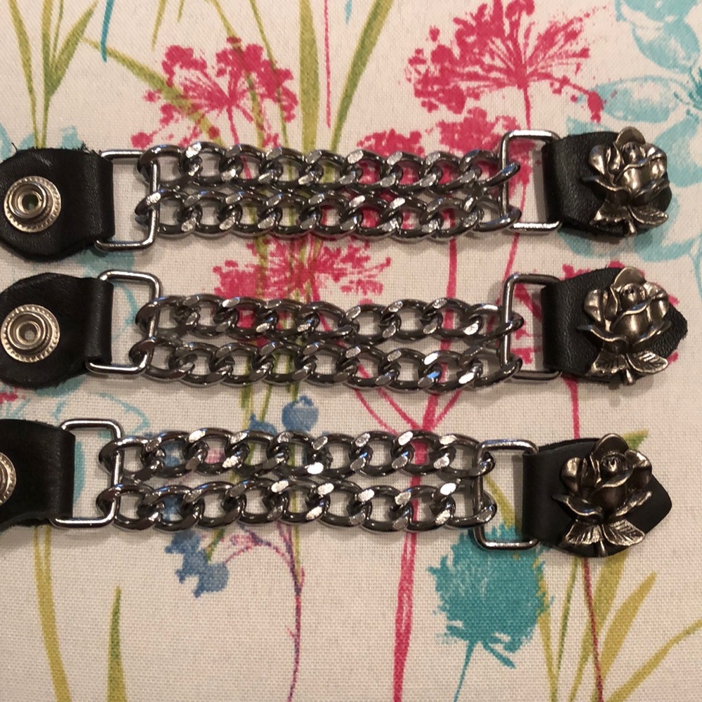 3 vest extensions with rose detailing.